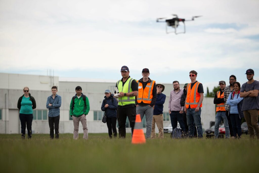 Fenix UAS course on field with instructor flying drone